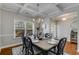 Dining room with modern chandelier, coffered ceilings, and a view to the backyard through a bright window at 3475 Summerlin Pkwy, Lithia Springs, GA 30122
