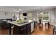 Open concept kitchen features granite countertops, a breakfast bar, stainless steel appliances, and lots of storage at 3475 Summerlin Pkwy, Lithia Springs, GA 30122