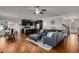 Open-concept living area with modern decor, hardwood floors, and a seamless flow to the kitchen and dining areas at 3475 Summerlin Pkwy, Lithia Springs, GA 30122