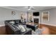 Cozy living room with a marble fireplace, plush seating, and plenty of natural light from the surrounding windows at 3475 Summerlin Pkwy, Lithia Springs, GA 30122