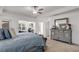 Beautiful main bedroom features neutral tones, tray ceilings, and lots of natural light at 3475 Summerlin Pkwy, Lithia Springs, GA 30122