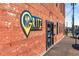 Close-up of the Gritz Brunch Bar entrance with a brick facade and branded signage at 3475 Summerlin Pkwy, Lithia Springs, GA 30122