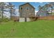 Well-manicured backyard featuring a sprawling lawn, landscaping, and some mature trees at 1944 Lakewood Se Ter, Atlanta, GA 30315