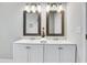 Modern bathroom featuring a double sink vanity with updated fixtures and stylish mirrors at 1944 Lakewood Se Ter, Atlanta, GA 30315