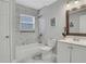 Clean bathroom with tiled shower, tub, and modern vanity at 1944 Lakewood Se Ter, Atlanta, GA 30315