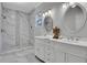 Beautiful bathroom featuring a marble-tiled shower and double sink vanity with modern fixtures at 1944 Lakewood Se Ter, Atlanta, GA 30315