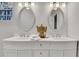 Elegant bathroom featuring a double vanity with modern fixtures and decorative accents at 1944 Lakewood Se Ter, Atlanta, GA 30315