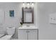 Bathroom featuring tiled backsplash, flower accent, and clean finishes at 1944 Lakewood Se Ter, Atlanta, GA 30315