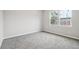 Bedroom featuring neutral walls and carpet with natural light from two windows at 1944 Lakewood Se Ter, Atlanta, GA 30315