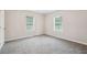 Neutral bedroom with carpet, white trim, two windows offering plenty of natural light at 1944 Lakewood Se Ter, Atlanta, GA 30315