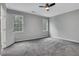 Spacious bedroom featuring plush gray carpet and ample natural light from the double windows at 1944 Lakewood Se Ter, Atlanta, GA 30315