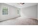 Bright, spacious bedroom with plush gray carpeting and ceiling fan at 1944 Lakewood Se Ter, Atlanta, GA 30315
