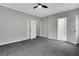 Large bedroom featuring neutral gray walls and plush carpeting, perfect for relaxation at 1944 Lakewood Se Ter, Atlanta, GA 30315