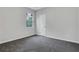 Bright bedroom with plush carpeting, a window for natural light, and neutral paint at 1944 Lakewood Se Ter, Atlanta, GA 30315