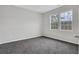 Well-lit bedroom featuring plush carpeting and large windows providing natural light at 1944 Lakewood Se Ter, Atlanta, GA 30315