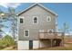 Back exterior of home with deck, gray siding, white trim, and walkout basement at 1944 Lakewood Se Ter, Atlanta, GA 30315