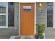 Close-up of a warm orange front door with decorative accents and inviting curb appeal at 1944 Lakewood Se Ter, Atlanta, GA 30315