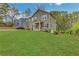 Charming two-story home with well-manicured lawn and welcoming orange front door at 1944 Lakewood Se Ter, Atlanta, GA 30315