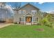 Charming two-story home with well-manicured lawn and welcoming orange front door at 1944 Lakewood Se Ter, Atlanta, GA 30315