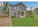 Charming two-story home with well-manicured lawn and welcoming orange front door at 1944 Lakewood Se Ter, Atlanta, GA 30315