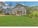 Charming two-story home with well-manicured lawn and welcoming orange front door at 1944 Lakewood Se Ter, Atlanta, GA 30315