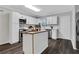 Updated kitchen featuring white cabinets, an island, stainless steel appliances, and hardwood floors at 1944 Lakewood Se Ter, Atlanta, GA 30315