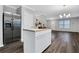 Open kitchen with white island, stainless steel appliances and hardwood floors at 1944 Lakewood Se Ter, Atlanta, GA 30315