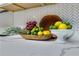 Kitchen featuring a marble countertop with a wooden bowl full of lemons, limes, bananas, pineapple and grapes at 1944 Lakewood Se Ter, Atlanta, GA 30315
