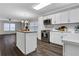 Bright kitchen with stainless steel appliances, white cabinetry, and hardwood floors at 1944 Lakewood Se Ter, Atlanta, GA 30315
