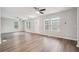 Bright, spacious living room with modern flooring, neutral paint, and stylish ceiling fans at 1944 Lakewood Se Ter, Atlanta, GA 30315