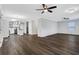 Spacious living room next to kitchen with hardwood floors and multiple ceiling fans at 1944 Lakewood Se Ter, Atlanta, GA 30315