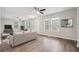 Bright, spacious living room with modern flooring, neutral paint, and stylish ceiling fans at 1944 Lakewood Se Ter, Atlanta, GA 30315