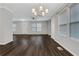 Bright living room with new hard wood floors and modern chandelier lighting at 1944 Lakewood Se Ter, Atlanta, GA 30315