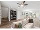 Open-concept living room with stairs, and views of the dining area and kitchen at 1944 Lakewood Se Ter, Atlanta, GA 30315
