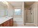 Bright bathroom featuring a soaking tub, shower, and vanity with double sinks at 3879 Brockenhurst Dr, Buford, GA 30519
