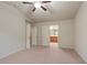 Primary bedroom with plush carpeting and access to primary bath at 3879 Brockenhurst Dr, Buford, GA 30519