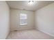 Cozy bedroom with carpet, a window for natural light, and neutral paint at 3879 Brockenhurst Dr, Buford, GA 30519