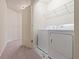 A laundry room with a modern washer and dryer setup at 3879 Brockenhurst Dr, Buford, GA 30519
