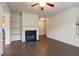 Inviting living room featuring a fireplace, built-in shelving, and hardwood floors at 3879 Brockenhurst Dr, Buford, GA 30519