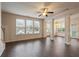Open living area with hardwood floors and decorative pillars at 3879 Brockenhurst Dr, Buford, GA 30519