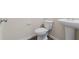 Cozy powder room with pedestal sink and wood floors at 3879 Brockenhurst Dr, Buford, GA 30519