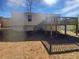 Backyard view with a raised wooden deck attached to the house at 5216 Sweet Air Ln, Stone Mountain, GA 30088