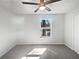 Cozy bedroom with fresh white walls and a ceiling fan at 5216 Sweet Air Ln, Stone Mountain, GA 30088