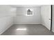 Neutral bedroom with carpet flooring, fresh paint, and ample natural light at 5216 Sweet Air Ln, Stone Mountain, GA 30088