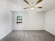 Bright bedroom features neutral walls, carpet, and a large window at 5216 Sweet Air Ln, Stone Mountain, GA 30088