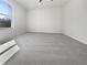 Spacious bedroom with carpet flooring and a bright window at 5216 Sweet Air Ln, Stone Mountain, GA 30088