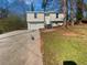 Charming home with a well-maintained front yard and driveway at 5216 Sweet Air Ln, Stone Mountain, GA 30088