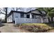 Charming single Gathering home with white siding, black trim and a quaint white fence in front at 884 Thurmond Nw St, Atlanta, GA 30314