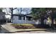 Charming single Gathering home with white siding, black trim and a quaint white fence in front at 884 Thurmond Nw St, Atlanta, GA 30314