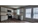 Bright kitchen featuring white cabinets, stainless appliances, and butcher block countertops at 884 Thurmond Nw St, Atlanta, GA 30314